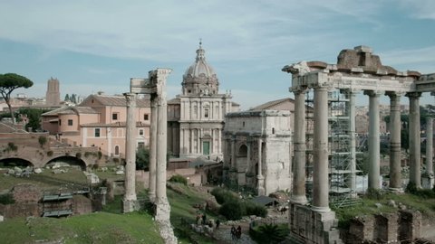 Panning right view of ancient Roman Forum or Foro Romano ruins seen from Capitoline Hill viewpoint in Rome, Italy. 4K UHD at 29.97fps