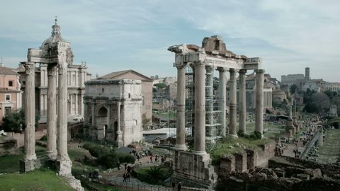 Panning left tilt up view of ancient Roman Forum or Foro Romano ruins seen from Capitoline Hill viewpoint in Rome, Italy. 4K UHD at 29.97fps