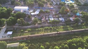Video footage aerial view clip of long line moving train on beautiful morning atmosphere.
