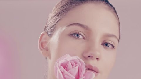 Beautiful young model with roses beauty skincare concept