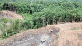 Deforestation. Rainforest in Borneo, Malaysia, destroyed for palm oil industry. Aerial drone footage of logging and environmental destruction 