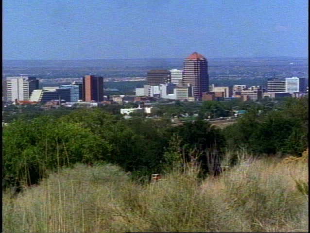 ALBUQUERQUE, 1999, Albuquerque, wide shot overlooking city with sagebrush in foreground