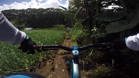 BALI INDONESIA, MAY 27 2018 : Downhill Mountain Biking from Rider's Point of View in Bali Bike Park 