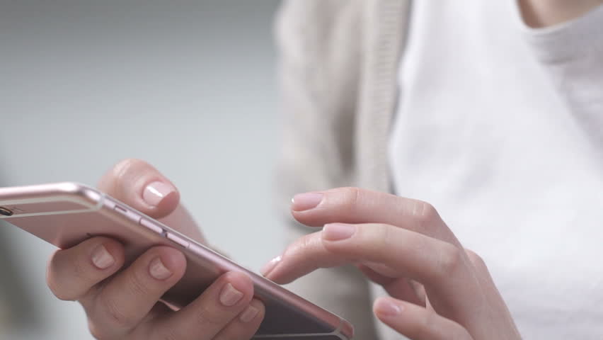 Woman using smartphone app, shopping online, booking tickets for airflight