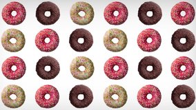 Abstract animation of various colorful donuts. Different directional orientations, vibrating against a white background