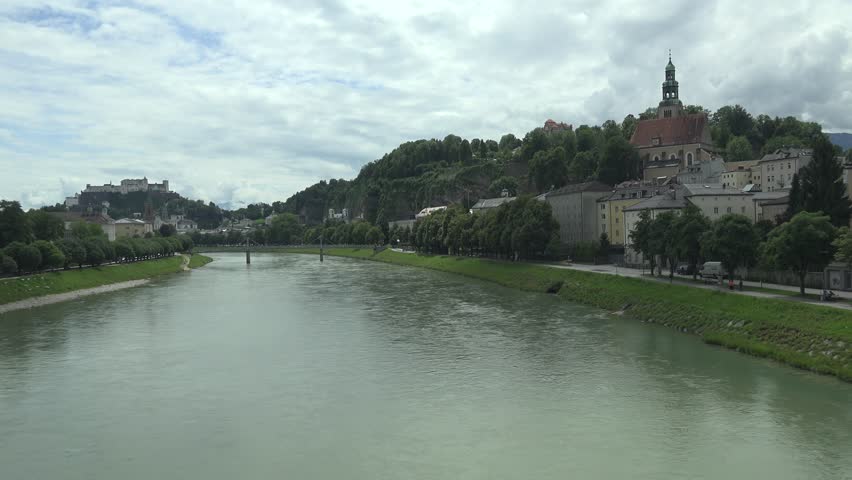 ULTRA HD 4K POV Point of view of train pass in front of Hohensalzburg Castle in Salzburg, landmark of Austria by day