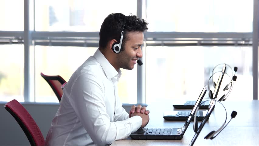 Pleasant call center worker, answering to questions. Man is saying goodbye on web camera, online converstation. Royalty-Free Stock Footage #1011552362