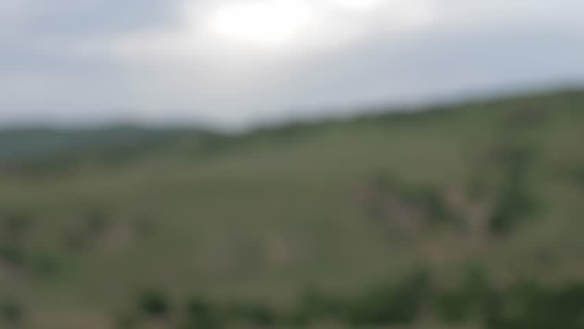 amazing close view transparent veil white fabric with sunlight patches waving on light wind in mountains