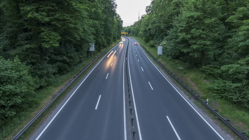 Highway A37 and traffic at dusk, time lapse shot. Germany. Lower Saxony. 4K.