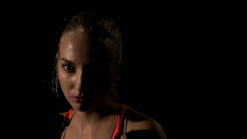 Young intense woman relaxing after boxing exercise. Shot in slow motion. | Shutterstock HD Video #1011560789