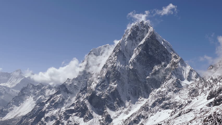 Spectacular view of Cholatse peak (6501 m) at sunrise. Nepal, Himalayas mountains. Time lapse zoom out. Royalty-Free Stock Footage #1011565088