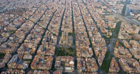 Aerial view of Barcelona Eixample residencial district with famous square urban grid, Spain. Afternoon light