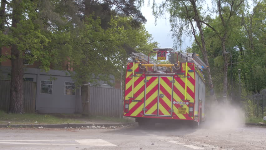Fire engine rushing to burning building