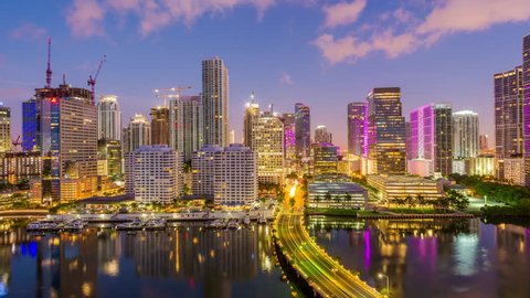 Miami, Florida, USA skyline time lapse over Biscayne Bay at dawn.