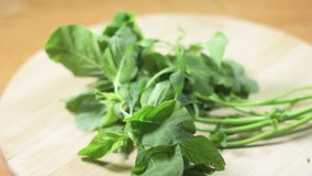 Lay fresh vegetable spinach on a wooden cutting board