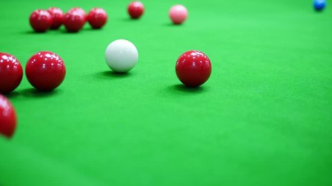 Slow motion of difficult snooker spider rest hand shot - snooker player in a real match competition concept 