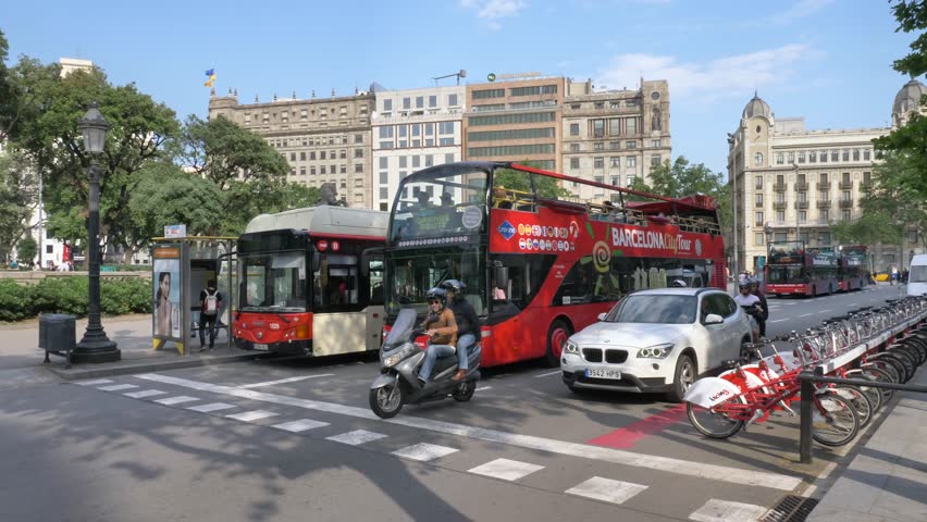 Barcelona, Spain - May 14, 2018: Barcelona city tour bus (Hop on/off) at Catalonia square. With three routes and a fleet of 74 buses, it offers a full coverage of the city