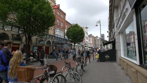 Dublin, Ireland - May, 2016: Men and women walking on King Street South in Dublin