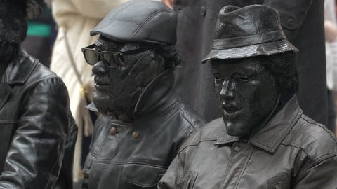 Dublin, Ireland - May, 2016: Close up of living statues painted in black