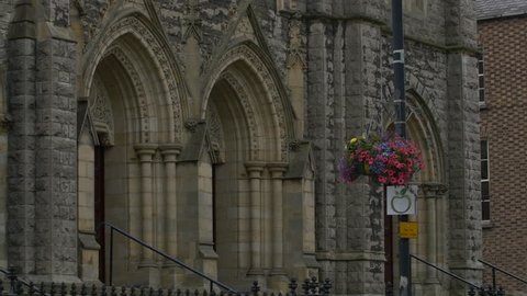Armagh, United Kingdom - May, 2016: Tilt up view of a stone wall facade with arches