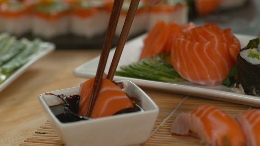 dipping sushi into soy sauce super Stock Footage Video (100% Royalty