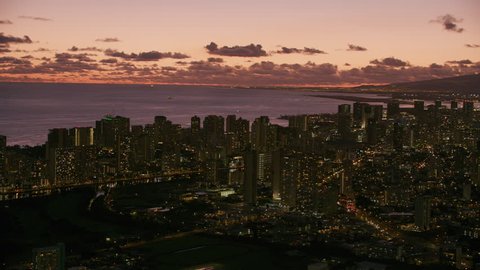 Honolulu, Oahu, Hawaii circa-2018. Aerial view of Honolulu and Waikiki at dusk. Shot with Cineflex and RED Epic-W Helium.