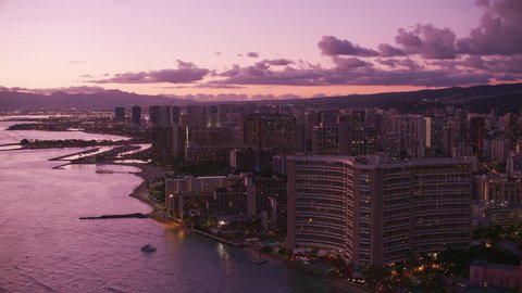 Honolulu, Oahu, Hawaii circa-2018. Aerial view of Waikiki at sunset. Shot with Cineflex and RED Epic-W Helium.