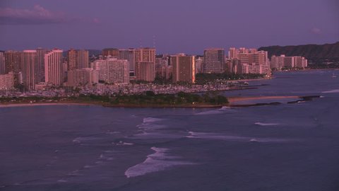 Honolulu, Oahu, Hawaii circa-2018. Aerial view of Magic Island and Waikiki at sunset. Shot with Cineflex and RED Epic-W Helium.