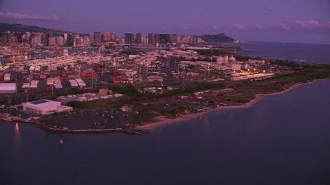 Honolulu, Oahu, Hawaii circa-2018. Aerial view of Honolulu Harbor at sunset. Shot with Cineflex and RED Epic-W Helium.