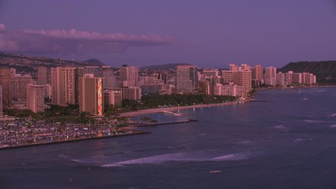 Honolulu, Oahu, Hawaii circa-2018. Aerial view of Waikiki at sunset. Shot with Cineflex and RED Epic-W Helium.