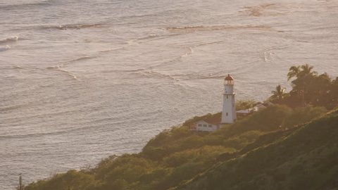 Honolulu, Oahu, Hawaii circa-2018. Aerial view of Diamond Head Lighthouse at sunset. Shot with Cineflex and RED Epic-W Helium.