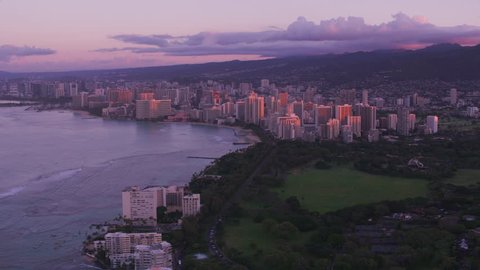 Honolulu, Oahu, Hawaii circa-2018. Aerial view of Waikiki Beach at sunset. Shot with Cineflex and RED Epic-W Helium.