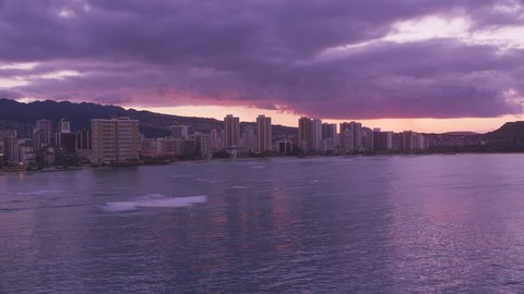 Honolulu, Oahu, Hawaii circa-2018. Aerial view of Waikiki hotels and beach at sunset. Shot with Cineflex and RED Epic-W Helium.