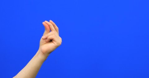 Hand with snapping fingers on blue screen background