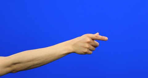 Male fingers grabbing and pulling something invisible toward him on blue screen 