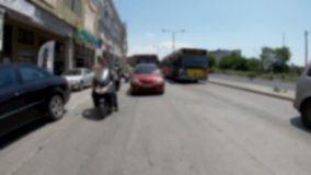 Driving in the City, blurred video suitable for use with green screen for the rear view windows of a car,  Captured with wide angle lens, In camera Stabilizer, No post editing, 4k video 3840X2160