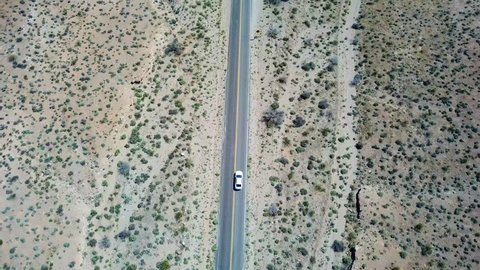 Car driving through desert highway