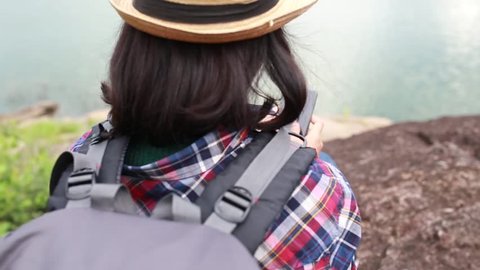 Hipster style women use smartphone searching map or GPS for travel in of her HD format  Video Stok