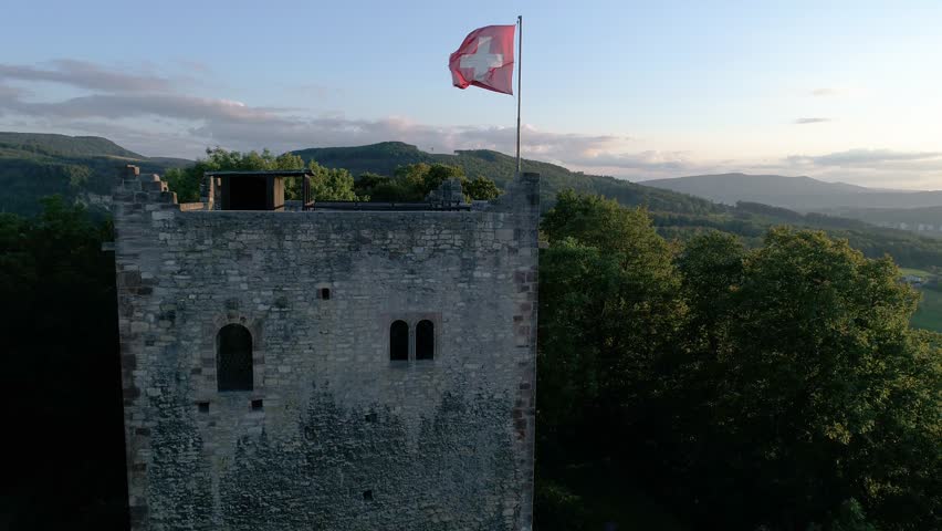old ruin with swiss flag aerial crane shot