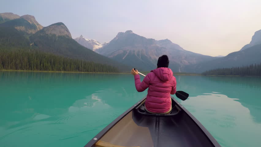 Man travelling on boat in lake on a sunny day 4k