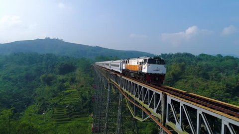 Bandung, West Java / Indonesia - June 30th 2017: Aerial View of a Train Crossing through the Longest Active Railway Bridge of Cikubang, West Java, Indonesia, Asia