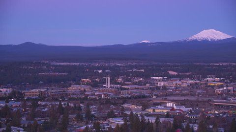 Oregon circa-2018. Aerial view of Bend, Oregon with Mt. Bachelor in distance. Shot from helicopter with Cineflex gimbal and RED Epic-W camera.
