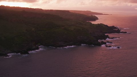Molokai, Hawaii circa-2018. Aerial view of sunset over Molokai coastline . Shot with Cineflex and RED Epic-W Helium.