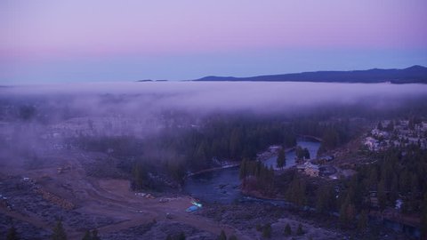 Oregon circa-2018. Flying over Deschutes river with low fog just outside of Bend, Oregon. Shot from helicopter with Cineflex gimbal and RED Epic-W camera.