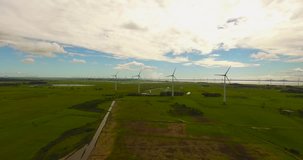 Rio Grande do Sul, Brazil 2018: Wind generation at renewable energy site. Green energy and wind turbines.	Aerial view of wind farm revealing wind turbines and open area.