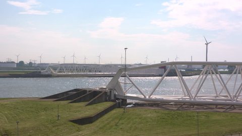 Two doors of the opened Maeslantkering or Maeslant Storm Surge Barrier, part of the Europoort Barrier of the Dutch Delta Plan, well protected in drydock ashore.