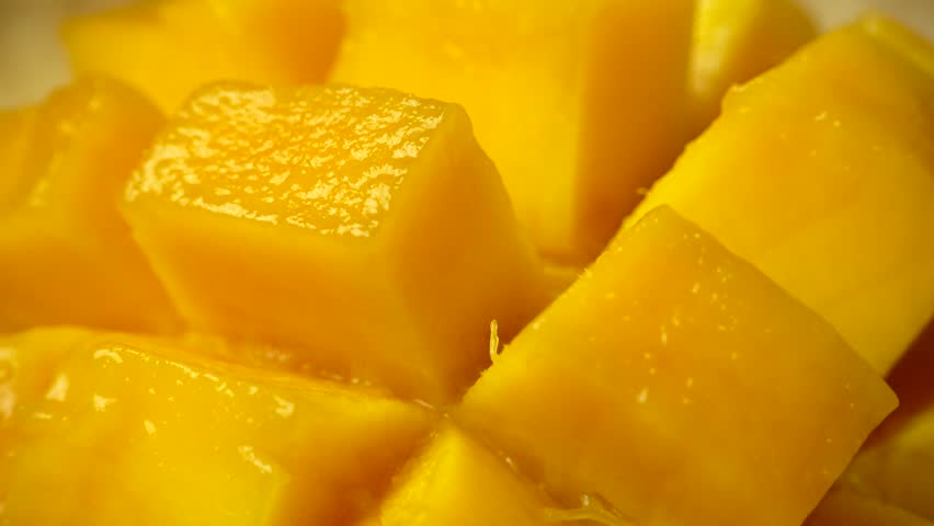 Rotation of rip mango slice cubes cut Royalty-Free Stock Footage #1011754406
