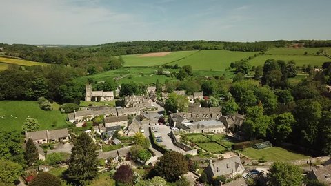Aerial of English small village on the Cotswold Hills in England