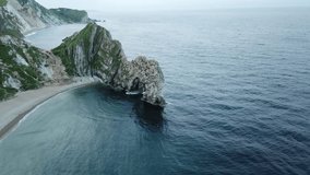 Aerial video of a famous Durdle Door in Dorset, United Kingdom. 