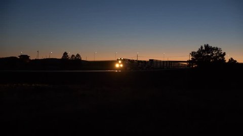 A freight train passing by at night